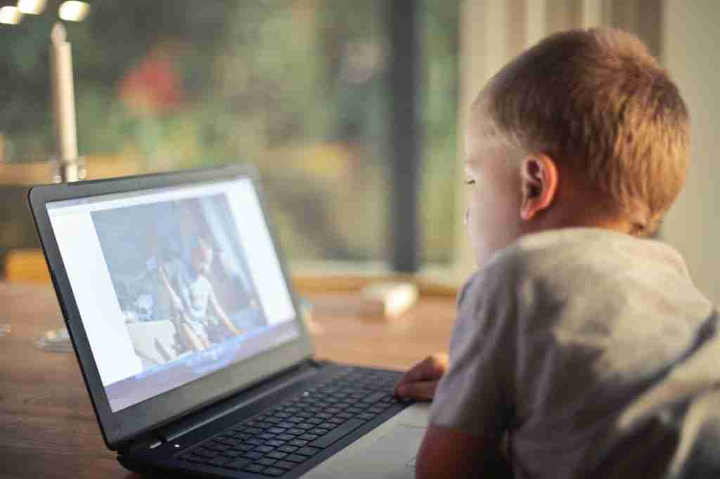 boy talking to friend on skype